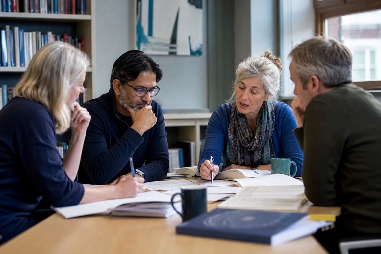 Qualified therapists and psychologists discussing advanced clinical material together